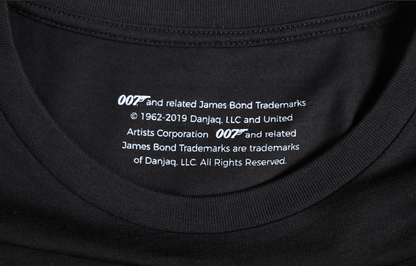 007 x SPYSCAPE T-Shirt - Close up of inside neck with size tag, "007 and related James Bond Trademarks, 1962-2019 Dan Janq, LLC and United Artist coorporation,  All rights reserved. 